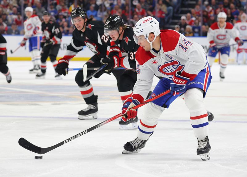 Dec 9, 2023; Buffalo, New York, USA;  Montreal Canadiens center Nick Suzuki (14) looks to make a pass during the third period against the Buffalo Sabres at KeyBank Center. Mandatory Credit: Timothy T. Ludwig-USA TODAY Sports