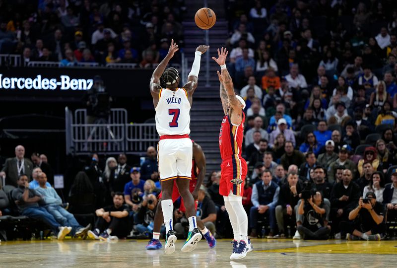 SAN FRANCISCO, CALIFORNIA - OCTOBER 29: Buddy Hield #7 of the Golden State Warriors shoots a three-point shot over Jose Alvarado #15 of the New Orleans Pelicans during the fourth quarter at Chase Center on October 29, 2024 in San Francisco, California. NOTE TO USER: User expressly acknowledges and agrees that, by downloading and or using this photograph, User is consenting to the terms and conditions of the Getty Images License Agreement. (Photo by Thearon W. Henderson/Getty Images)