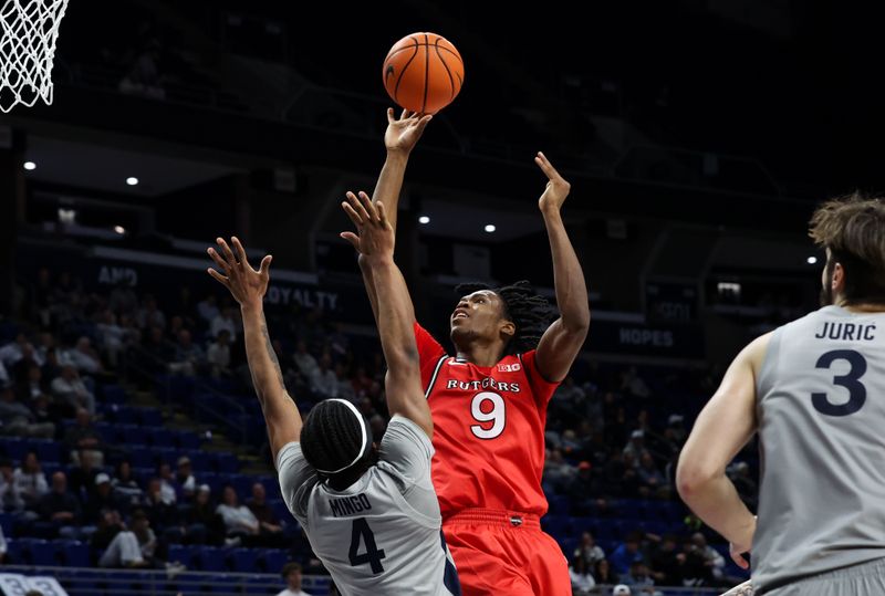 Feb 18, 2026; University Park, Pennsylvania, USA; Rutgers Scarlet Knights forward Dylan Grant (9) shoots the ball as Penn State Nittany Lions guard Kayden Mingo (4) defends during the second half at Bryce Jordan Center. Mandatory Credit: Matthew O'Haren-Imagn Images
