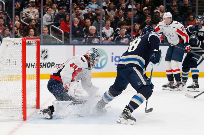 Oct 24, 2025; Columbus, Ohio, USA; Washington Capitals goalie Logan Thompson (48) makes a save on the tip shot from Columbus Blue Jackets center Boone Jenner (38) during the second period at Nationwide Arena. Mandatory Credit: Russell LaBounty-Imagn Images