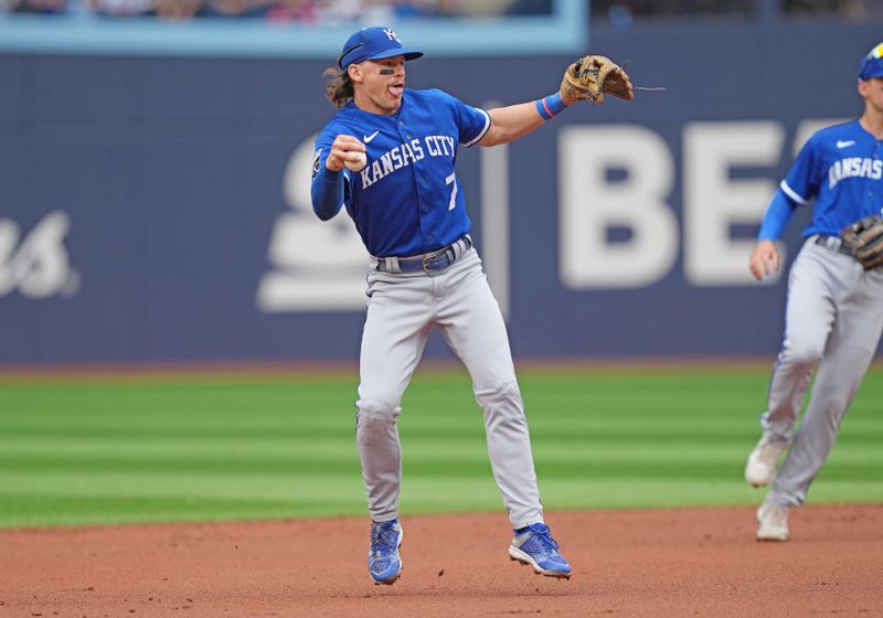 Sep 9, 2023; Toronto, Ontario, CAN; Kansas City Royals shortstop Bobby Witt Jr. (7) makes a one handed grab and throws to first base for an out against the Toronto Blue Jays during the first inning at Rogers Centre. Mandatory Credit: Nick Turchiaro-USA TODAY Sports