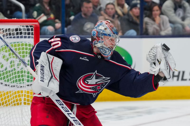 Jan 6, 2024; Columbus, Ohio, USA;  Columbus Blue Jackets goaltender Daniil Tarasov (40) attempts a glove save in net against the Minnesota Wild in the second period at Nationwide Arena. Mandatory Credit: Aaron Doster-USA TODAY Sports