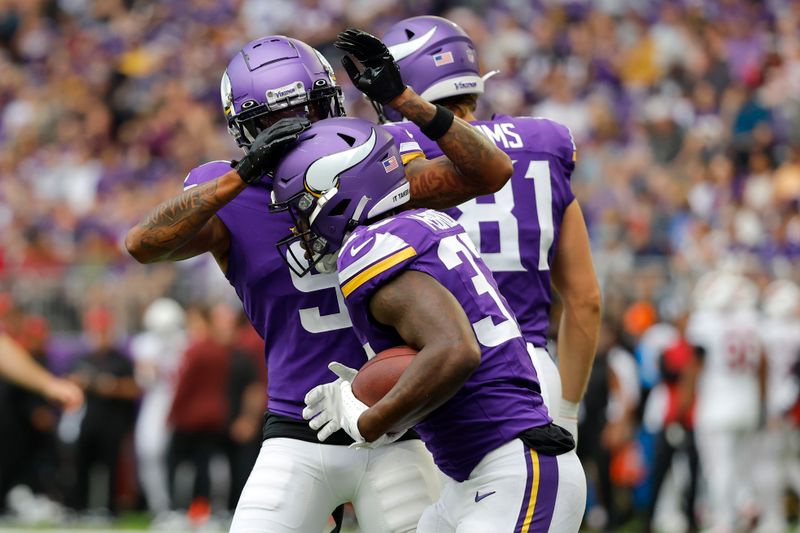 Minnesota Vikings running back DeWayne McBride (37) celebrates his touchdown against the Arizona Cardinals during the first half of an NFL preseason football game, Saturday, Aug. 26, 2023, in Minneapolis. (AP Photo/Bruce Kluckhohn)