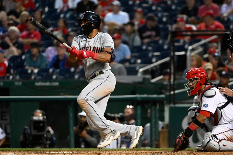 Apr 15, 2023; Washington, District of Columbia, USA; Cleveland Guardians shortstop Amed Rosario (1) singles against the Washington Nationals during the seventh inning at Nationals Park. Mandatory Credit: Brad Mills-USA TODAY Sports