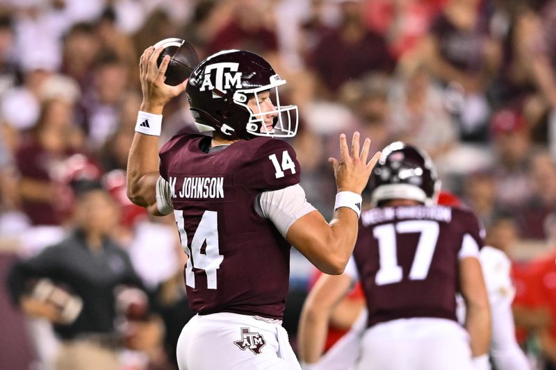 Sep 2, 2023; College Station, Texas, USA; Texas A&M Aggies quarterback Max Johnson (14) throws the ball during the fourth quarter against New Mexico Lobos at Kyle Field. Mandatory Credit: Maria Lysaker-USA TODAY Sports