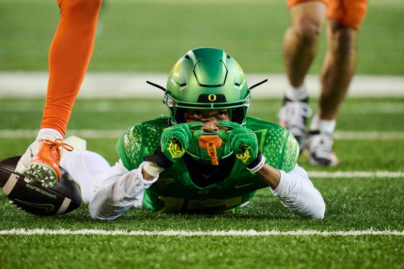 Nov 24, 2023; Eugene, Oregon, USA; Oregon Ducks wide receiver Tez Johnson (15) makes a sign with his fingers showing how close he was to scoring a touchdown after catching a pass during the second half against the Oregon State Beavers at Autzen Stadium. Mandatory Credit: Troy Wayrynen-USA TODAY Sports