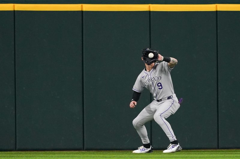 May 13, 2025; Arlington, Texas, USA; Colorado Rockies outfielder Brenton Doyle (9) makes the catch of a fly ball during the third inning against the Texas Rangers at Globe Life Field. Mandatory Credit: Raymond Carlin III-Imagn Images