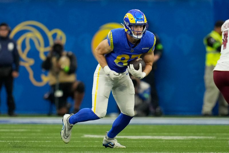 Los Angeles Rams tight end Davis Allen (87) runs the ball during the second half of an NFL football game against the Washington Commanders Sunday, Dec. 17, 2023, in Inglewood, Calif. (AP Photo/Marcio Jose Sanchez)