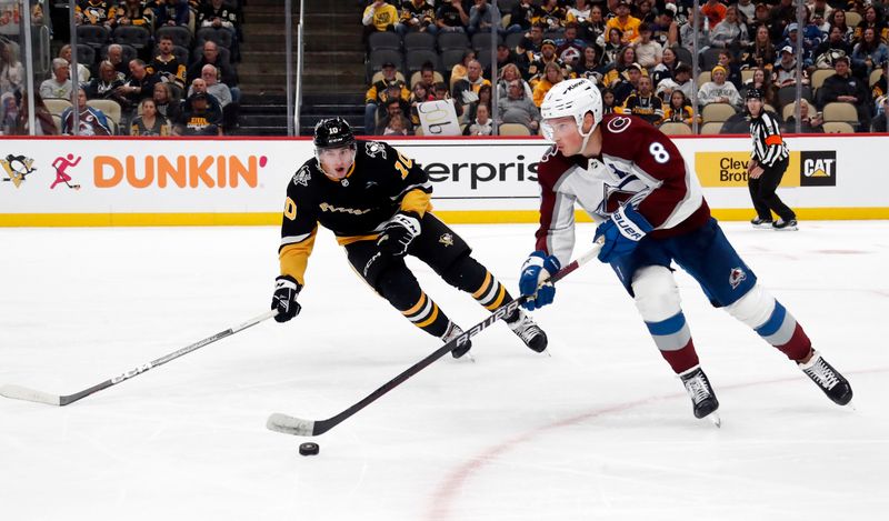 Oct 26, 2023; Pittsburgh, Pennsylvania, USA; Colorado Avalanche defenseman Cale Makar (8) moves the puck against Pittsburgh Penguins left wing Drew O'Connor (10) during the third period at PPG Paints Arena. The Penguins shutout the Avalanche 4-0. Mandatory Credit: Charles LeClaire-USA TODAY Sports