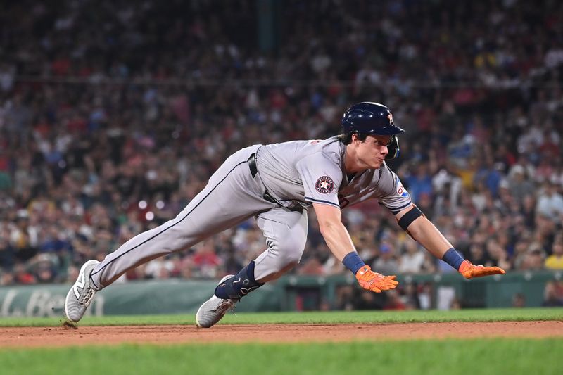 Aug 9, 2024; Boston, Massachusetts, USA; Houston Astros center fielder Jake Meyers (6) slides into third base during the seventh inning against the Boston Red Sox at Fenway Park. Mandatory Credit: Eric Canha-USA TODAY Sports