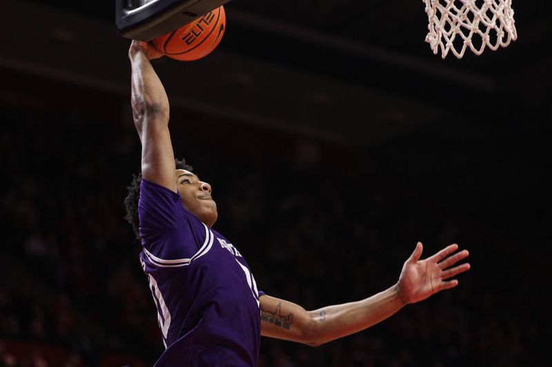 Jan 11, 2026; Piscataway, New Jersey, USA; Northwestern Wildcats guard Justin Mullins (20) goes up for a dunk  against the Rutgers Scarlet Knights during the first half at Jersey Mike's Arena. Mandatory Credit: Vincent Carchietta-Imagn Images