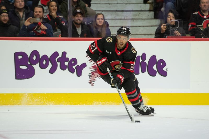 Nov 4, 2023; Ottawa, Ontario, CAN; Ottawa Senators right wing Mathieu Joseph (21) skates with the puck in the first period against the Tampa Bay Lightning at the Canadian Tire Centre. Mandatory Credit: Marc DesRosiers-USA TODAY Sports