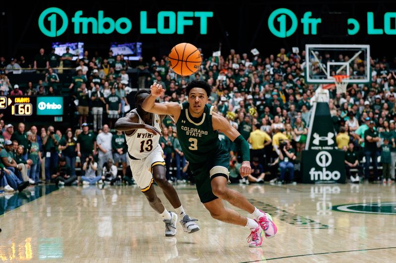 Mar 2, 2024; Fort Collins, Colorado, USA; Colorado State Rams guard Josiah Strong (3) grabs a loose ball ahead of Wyoming Cowboys guard Akuel Kot (13) in the second half at Moby Arena. Mandatory Credit: Isaiah J. Downing-USA TODAY Sports