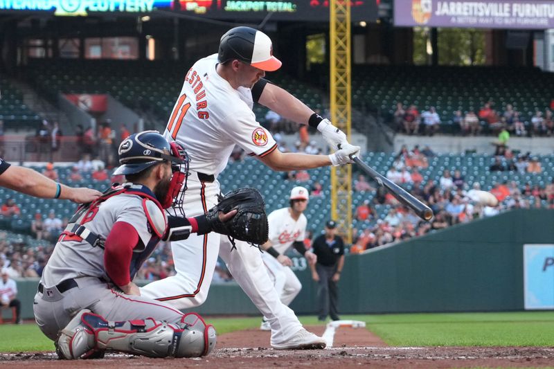 May 28, 2024; Baltimore, Maryland, USA; Baltimore Orioles third baseman Jordan Westburg (11) singles in the first inning to drive in two runs against the Boston Red Sox at Oriole Park at Camden Yards. Mandatory Credit: Mitch Stringer-USA TODAY Sports