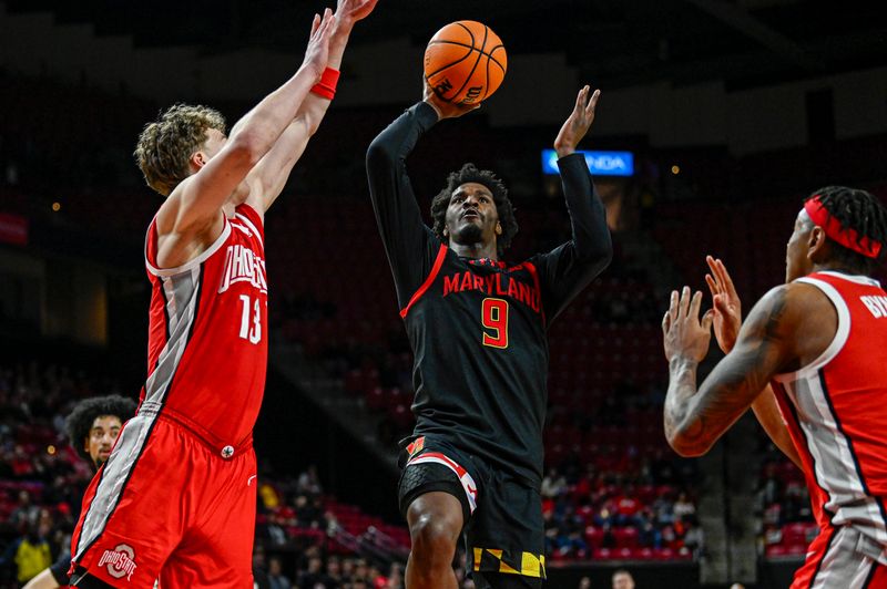 Feb 5, 2026; College Park, Maryland, USA;  Maryland Terrapins forward Solomon Washington (9) shoots as Ohio State Buckeyes center Christoph Tilly (13) and forward Amare Bynum (1) defends during the second half at Xfinity Center. Mandatory Credit: Tommy Gilligan-Imagn Images