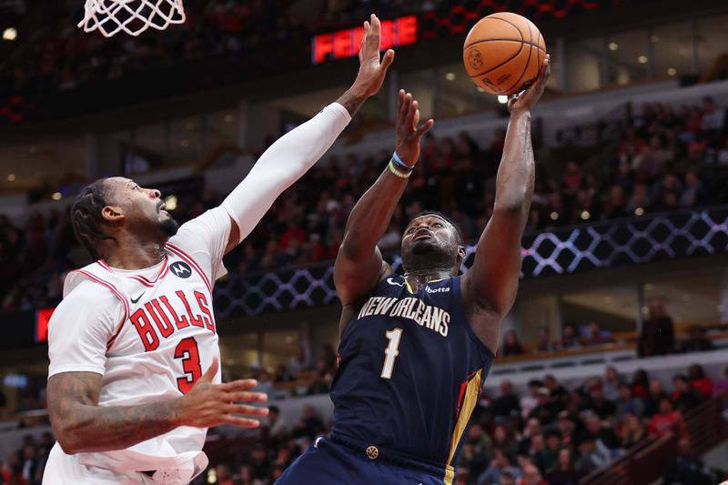 CHICAGO, ILLINOIS - DECEMBER 02: Zion Williamson #1 of the New Orleans Pelicans goes up for a layup against Andre Drummond #3 of the Chicago Bulls during the second half at the United Center on December 02, 2023 in Chicago, Illinois. NOTE TO USER: User expressly acknowledges and agrees that, by downloading and or using this photograph, User is consenting to the terms and conditions of the Getty Images License Agreement.  (Photo by Michael Reaves/Getty Images)