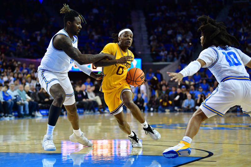 Mar 2, 2023; Los Angeles, California, USA; Arizona State Sun Devils guard DJ Horne (0) moves to the basket against UCLA Bruins forward Kenneth Nwuba (14) and guard Tyger Campbell (10) during the first half at Pauley Pavilion. Mandatory Credit: Gary A. Vasquez-USA TODAY Sports