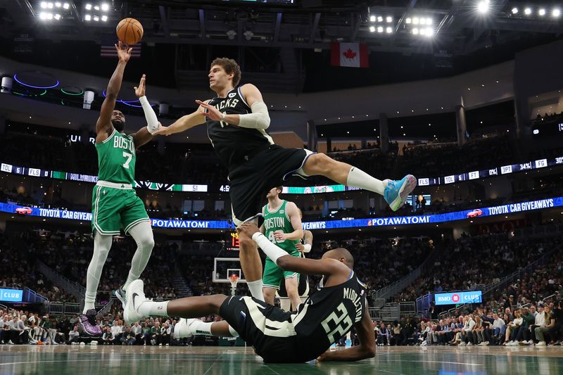 MILWAUKEE, WISCONSIN - APRIL 09: Jaylen Brown #7 of the Boston Celtics is defended by Brook Lopez #11 of the Milwaukee Bucks during a game at Fiserv Forum on April 09, 2024 in Milwaukee, Wisconsin. NOTE TO USER: User expressly acknowledges and agrees that, by downloading and or using this photograph, User is consenting to the terms and conditions of the Getty Images License Agreement. (Photo by Stacy Revere/Getty Images)