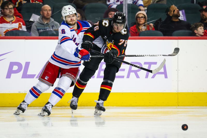 Nov 21, 2024; Calgary, Alberta, CAN; Calgary Flames center Martin Pospisil (76) and New York Rangers defenseman Zac Jones (6) battles for the puck during the second period at Scotiabank Saddledome. Mandatory Credit: Sergei Belski-Imagn Images