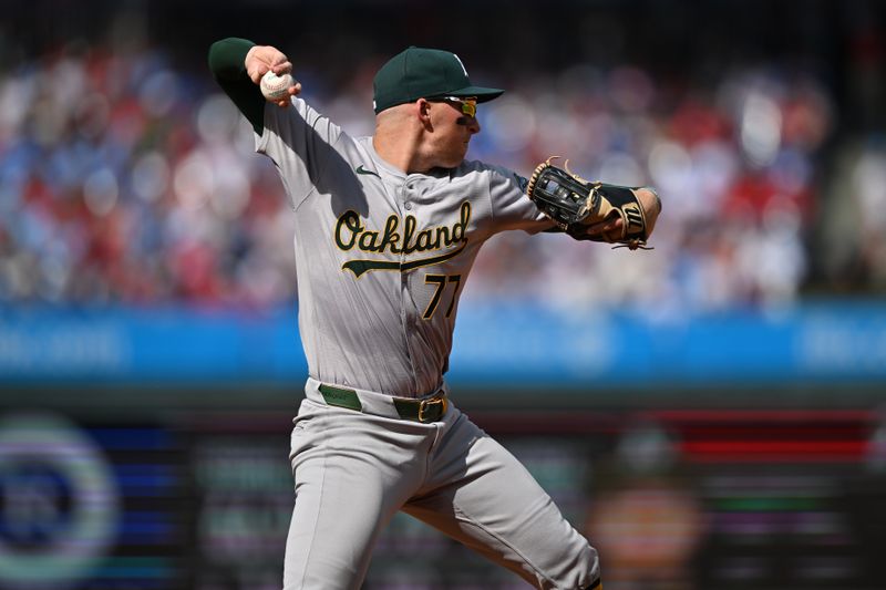 Jul 13, 2024; Philadelphia, Pennsylvania, USA; Oakland Athletics third baseman Brett Harris (77) throws to first against the Philadelphia Phillies in the second inning at Citizens Bank Park. Mandatory Credit: Kyle Ross-USA TODAY Sports