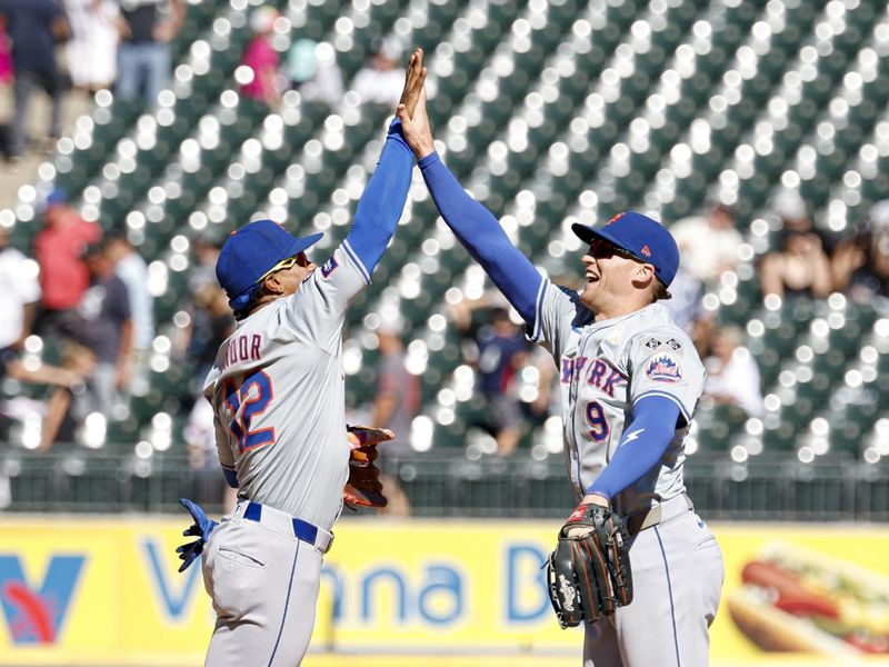 Sep 1, 2024; Chicago, Illinois, USA; New York Mets shortstop Francisco Lindor (12) and outfielder Brandon Nimmo (9) celebrate after defeating the Chicago White Sox in a baseball game at Guaranteed Rate Field. Mandatory Credit: Kamil Krzaczynski-USA TODAY Sports