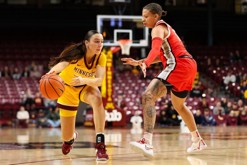 Feb 8, 2024; Minneapolis, Minnesota, USA; Minnesota Golden Gophers guard Maggie Czinano (5) passes as Ohio State Buckeyes guard Rikki Harris (1) defends during the first half at Williams Arena. Mandatory Credit: Matt Krohn-USA TODAY Sports