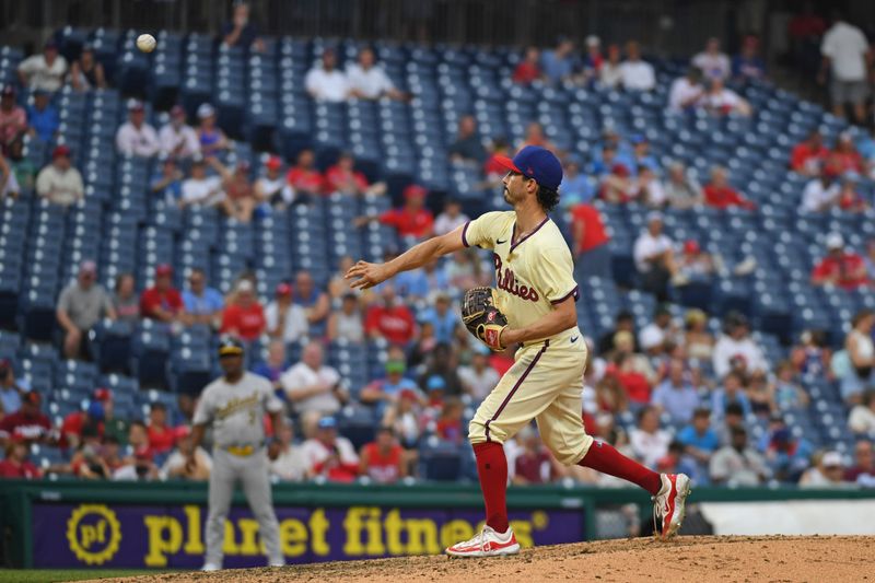 Jul 14, 2024; Philadelphia, Pennsylvania, USA; Philadelphia Phillies catcher Garrett Stubbs (21) throws a pitch during the ninth inning against the Oakland Athletics at Citizens Bank Park. Mandatory Credit: Eric Hartline-USA TODAY Sports