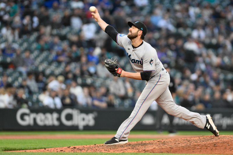 Jun 14, 2023; Seattle, Washington, USA; Miami Marlins relief pitcher Dylan Floro (36) pitches to the Seattle Mariners during the seventh inning at T-Mobile Park. Mandatory Credit: Steven Bisig-USA TODAY Sports