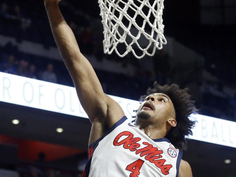 Jan 31, 2023; Oxford, Mississippi, USA; Mississippi Rebels forward Jaemyn Brakefield (4) drives to the basket during the second half against the Kentucky Wildcats at The Sandy and John Black Pavilion at Ole Miss. Mandatory Credit: Petre Thomas-USA TODAY Sports