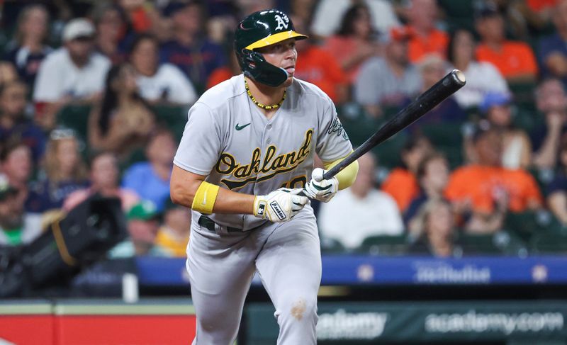 Sep 11, 2023; Houston, Texas, USA; Oakland Athletics first baseman Ryan Noda (49) hits a home run during the ninth inning against the Houston Astros at Minute Maid Park. Mandatory Credit: Troy Taormina-USA TODAY Sports