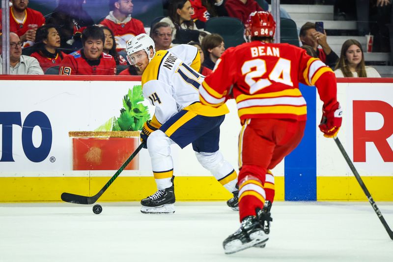 Nov 15, 2024; Calgary, Alberta, CAN; Nashville Predators center Gustav Nyquist (14) controls the puck against the Calgary Flames during the third period at Scotiabank Saddledome. Mandatory Credit: Sergei Belski-Imagn Images