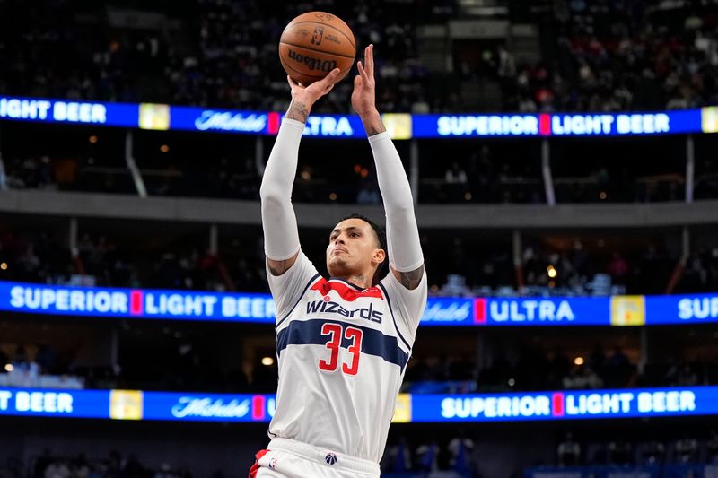 DALLAS, TEXAS - FEBRUARY 12: Kyle Kuzma #33 of the Washington Wizards shoots during the first half against the Dallas Mavericks at American Airlines Center on February 12, 2024 in Dallas, Texas. NOTE TO USER: User expressly acknowledges and agrees that, by downloading and or using this photograph, User is consenting to the terms and conditions of the Getty Images License Agreement. (Photo by Sam Hodde/Getty Images)