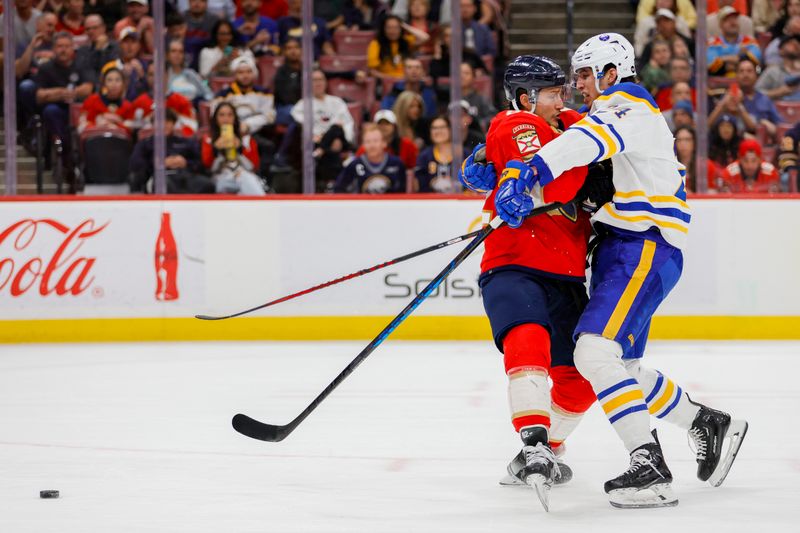 Apr 4, 2023; Sunrise, Florida, USA; Florida Panthers defenseman Brandon Montour (62) and Buffalo Sabres center Dylan Cozens (24) collide during the first period at FLA Live Arena. Mandatory Credit: Sam Navarro-USA TODAY Sports