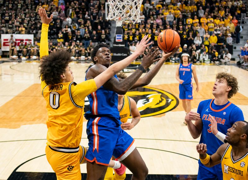 Jan 20, 2024; Columbia, Missouri, USA; Florida Gators forward Tyrese Samuel (4) shoots against Missouri Tigers forward Jordan Butler (0) during the first half at Mizzou Arena. Mandatory Credit: Jay Biggerstaff-USA TODAY Sports