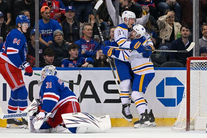 Nov 7, 2024; New York, New York, USA;  Buffalo Sabres center Sam Lafferty (81) celebrates his goal with left wing Beck Malenstyn (29) against the New York Rangers during the second period at Madison Square Garden. Mandatory Credit: Dennis Schneidler-Imagn Images