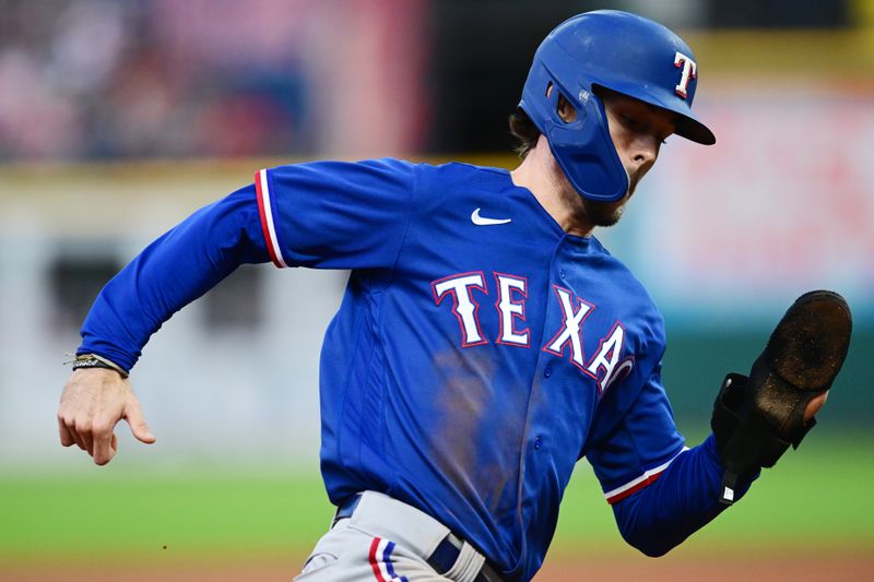 Sep 16, 2023; Cleveland, Ohio, USA; Texas Rangers left fielder Evan Carter (32) rounds third base en route to scoring during the fifth inning against the Cleveland Guardians at Progressive Field. Mandatory Credit: Ken Blaze-USA TODAY Sports