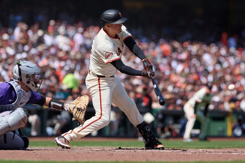 May 4, 2025; San Francisco, California, USA; San Francisco Giants first baseman Wilmer Flores (41) hits an RBI double against the Colorado Rockies during the seventh inning at Oracle Park. Mandatory Credit: Robert Edwards-Imagn Images
