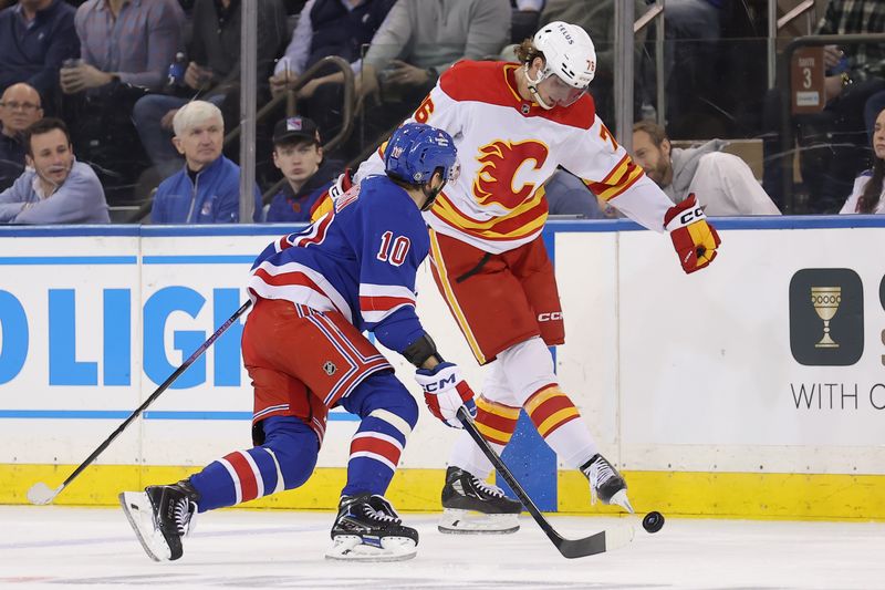 Feb 12, 2024; New York, New York, USA; Calgary Flames center Martin Pospisil (76) kicks the puck against New York Rangers left wing Artemi Panarin (10) during the second period at Madison Square Garden. Mandatory Credit: Brad Penner-USA TODAY Sports