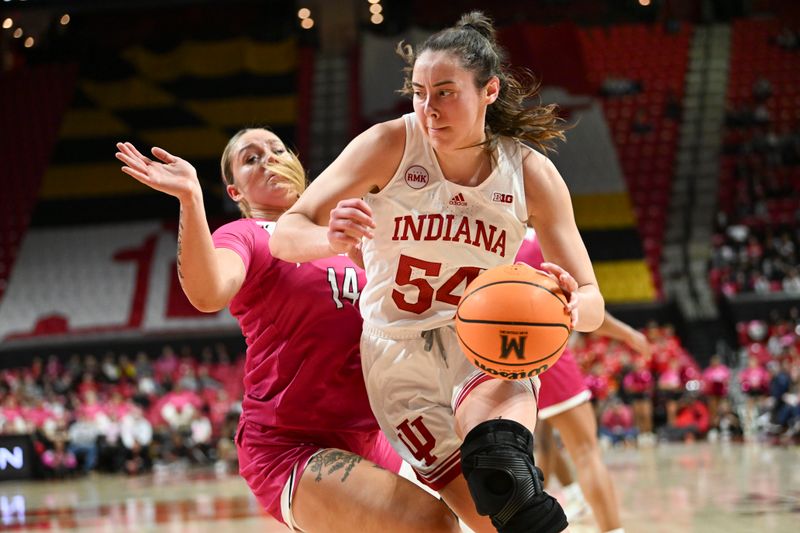 Jan 31, 2024; College Park, Maryland, USA;  Indiana Hoosiers forward Mackenzie Holmes (54) makes a moe to the bakst on Maryland Terrapins forward Allie Kubek (14) during the first half 
at Xfinity Center. Mandatory Credit: Tommy Gilligan-USA TODAY Sports