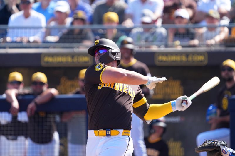 Mar 9, 2026; Peoria, Arizona, USA; San Diego Padres third baseman Ty France (4) bats against the Texas Rangers during the second inning at Peoria Sports Complex. Mandatory Credit: Joe Camporeale-Imagn Images