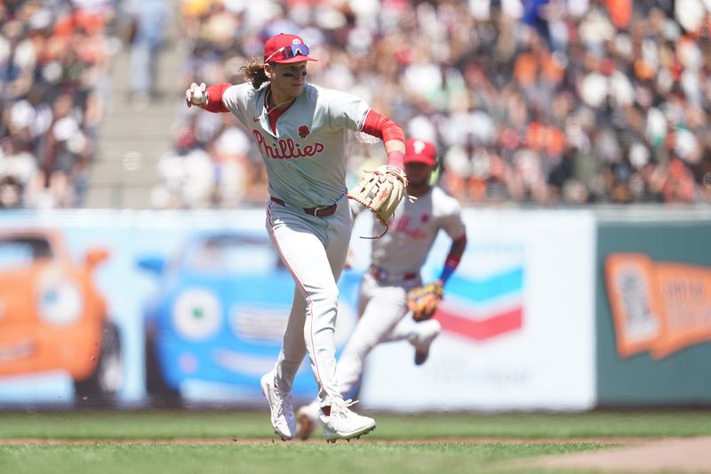 May 27, 2024; San Francisco, California, USA; Philadelphia Phillies third baseman Alec Bohm (28) throws to first to record an out against the San Francisco Giants in the first inning at Oracle Park. Mandatory Credit: Cary Edmondson-USA TODAY Sports