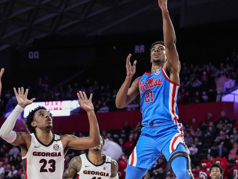 Feb 7, 2023; Athens, Georgia, USA; Mississippi Rebels forward Robert Allen (21) shoots over Georgia Bulldogs center Braelen Bridges (23) during the first half at Stegeman Coliseum. Mandatory Credit: Dale Zanine-USA TODAY Sports