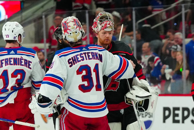 May 16, 2024; Raleigh, North Carolina, USA; New York Rangers goaltender Igor Shesterkin (31) and Carolina Hurricanes goaltender Frederik Andersen (31) shake hands after the New York Rangers victory in game six of the second round of the 2024 Stanley Cup Playoffs at PNC Arena. Mandatory Credit: James Guillory-USA TODAY Sports