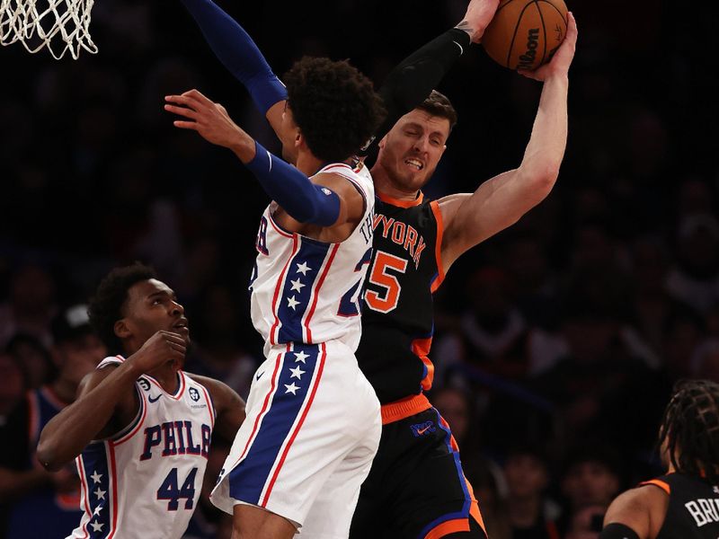 NEW YORK, NEW YORK - FEBRUARY 05:  Isaiah Hartenstein #55 of the New York Knicks grabs the rebound before Matisse Thybulle #22 of the Philadelphia 76ers in the second half at Madison Square Garden on February 05, 2023 in New York City. The New York Knicks defeated the Philadelphia 76ers 108-97. NOTE TO USER: User expressly acknowledges and agrees that, by downloading and or using this photograph, User is consenting to the terms and conditions of the Getty Images License Agreement. (Photo by Elsa/Getty Images)