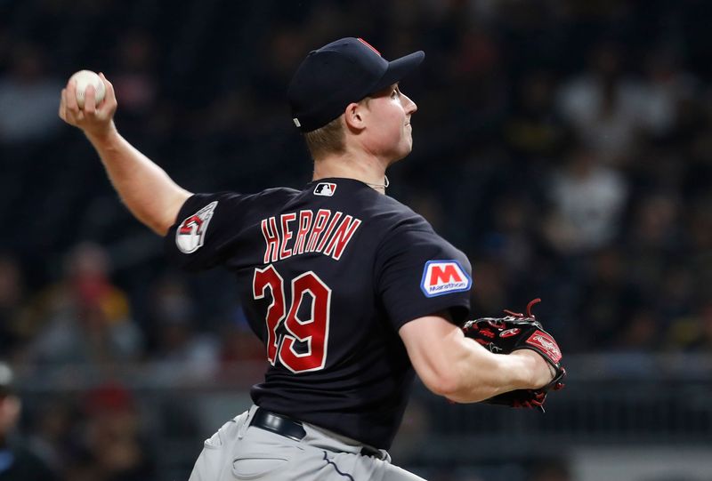 Jul 18, 2023; Pittsburgh, Pennsylvania, USA; Cleveland Guardians relief pitcher Tim Herrin (29) pitches against the Pittsburgh Pirates during the ninth inning at PNC Park. Cleveland won 10-1. Mandatory Credit: Charles LeClaire-USA TODAY Sports