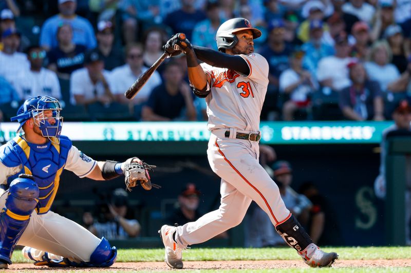 Aug 13, 2023; Seattle, Washington, USA; Baltimore Orioles center fielder Cedric Mullins (31) hits a two-run home run against the Seattle Mariners during the tenth inning at T-Mobile Park. Mandatory Credit: Joe Nicholson-USA TODAY Sports