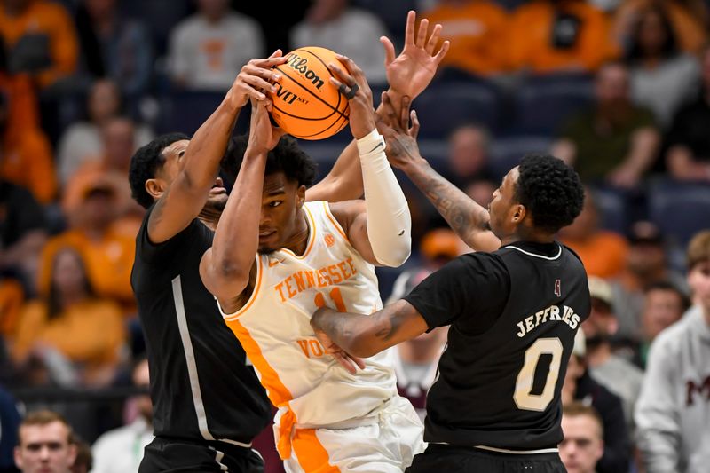 Mar 15, 2024; Nashville, TN, USA; Mississippi State Bulldogs forward D.J. Jeffries (0) and Tennessee Volunteers forward Tobe Awaka (11) fight for the ball during the first half at Bridgestone Arena. Mandatory Credit: Steve Roberts-USA TODAY Sports