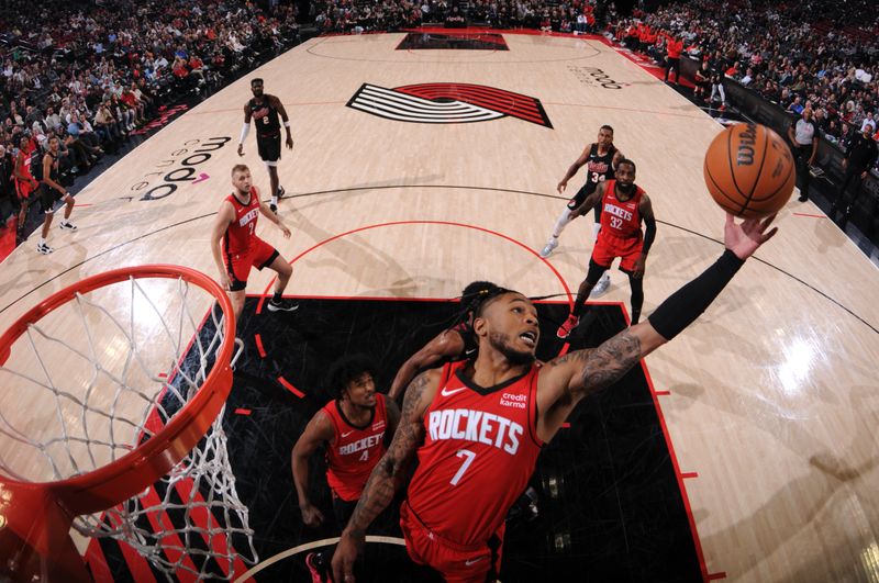 PORTLAND, OR - APRIL 12: Cam Whitmore #7 of the Houston Rockets goes up for the rebound during the game against the Portland Trail Blazers on April 12, 2024 at the Moda Center Arena in Portland, Oregon. NOTE TO USER: User expressly acknowledges and agrees that, by downloading and or using this photograph, user is consenting to the terms and conditions of the Getty Images License Agreement. Mandatory Copyright Notice: Copyright 2024 NBAE (Photo by Cameron Browne/NBAE via Getty Images)