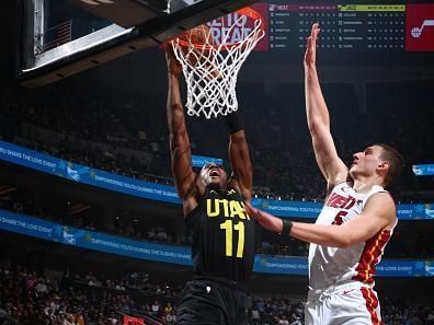 SALT LAKE CITY, UT - DECEMBER 30: Kris Dunn #11 of the Utah Jazz dunks the ball during the game against the Miami Heat on December 30, 2023 at Delta Center in Salt Lake City, Utah. NOTE TO USER: User expressly acknowledges and agrees that, by downloading and or using this Photograph, User is consenting to the terms and conditions of the Getty Images License Agreement. Mandatory Copyright Notice: Copyright 2023 NBAE (Photo by Melissa Majchrzak/NBAE via Getty Images)