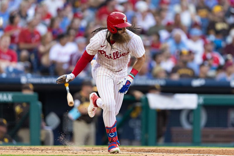 Jun 18, 2024; Philadelphia, Pennsylvania, USA; Philadelphia Phillies outfielder Brandon Marsh (16) hits an RBI single during the fourth inning against the San Diego Padres at Citizens Bank Park. Mandatory Credit: Bill Streicher-USA TODAY Sports
